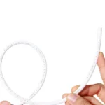 Hand holding a curved length of white P-DN6 PE water filter pipe